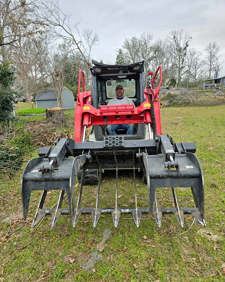 Patrick Giles operating Takeuchi compact track loader in Hahira GA